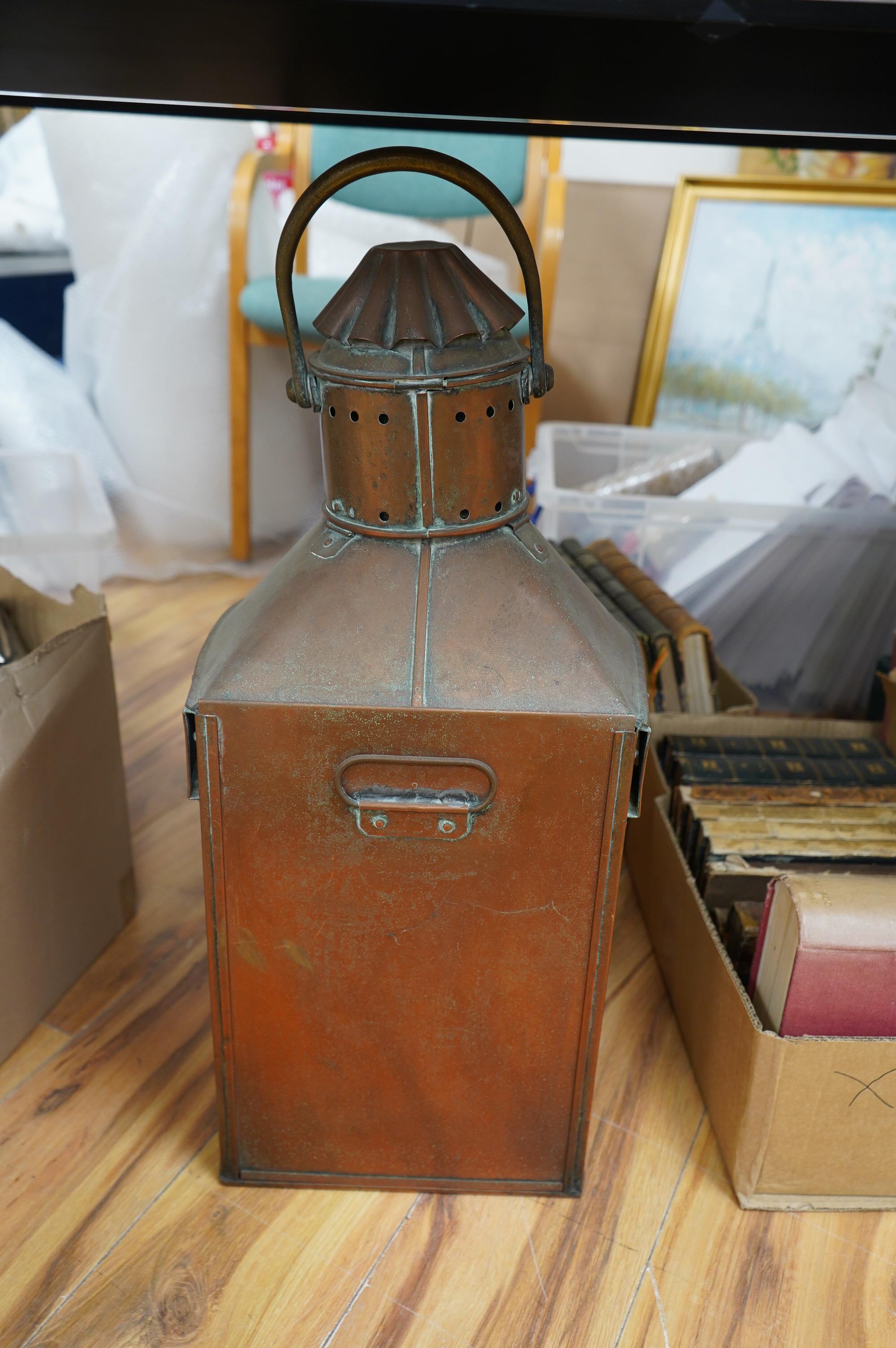 An early 20th century ship’s copper mast head lamp, 69cm high. Condition - fair